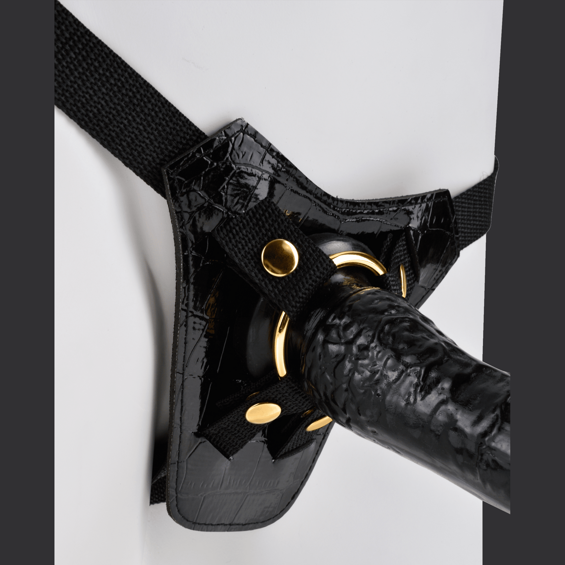 "Designer" strap-on vyö